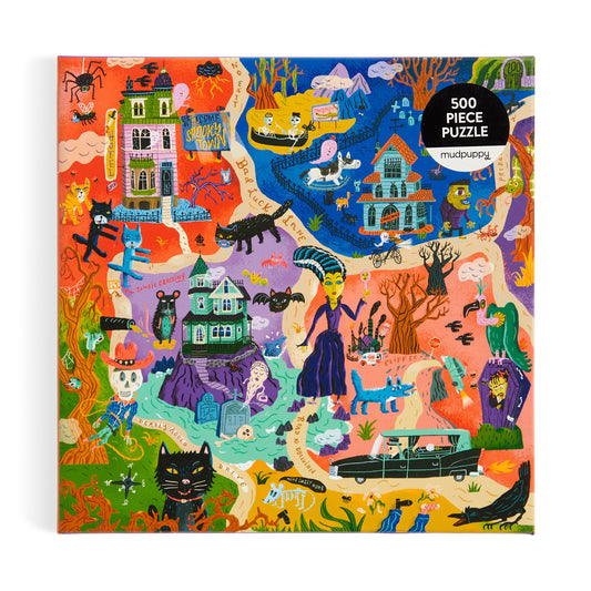The Welcome to Spooky Town 500 Piece Family Puzzle by Stephanie Birdsong features colorful Halloween scenes with haunted houses, skeletons, witches, black cats, a hearse, monsters, and bats on the illustrated box.