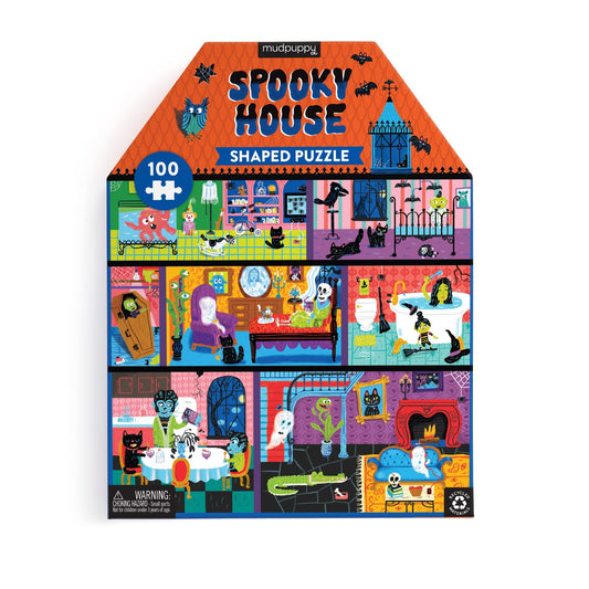The Stephanie Birdsong Spooky House 100 Pc House-Shaped Puzzle comes in a colorful box with playful cartoon ghosts, skeletons, black cats, and bats—making a whimsical Halloween home for haunted house fun.
