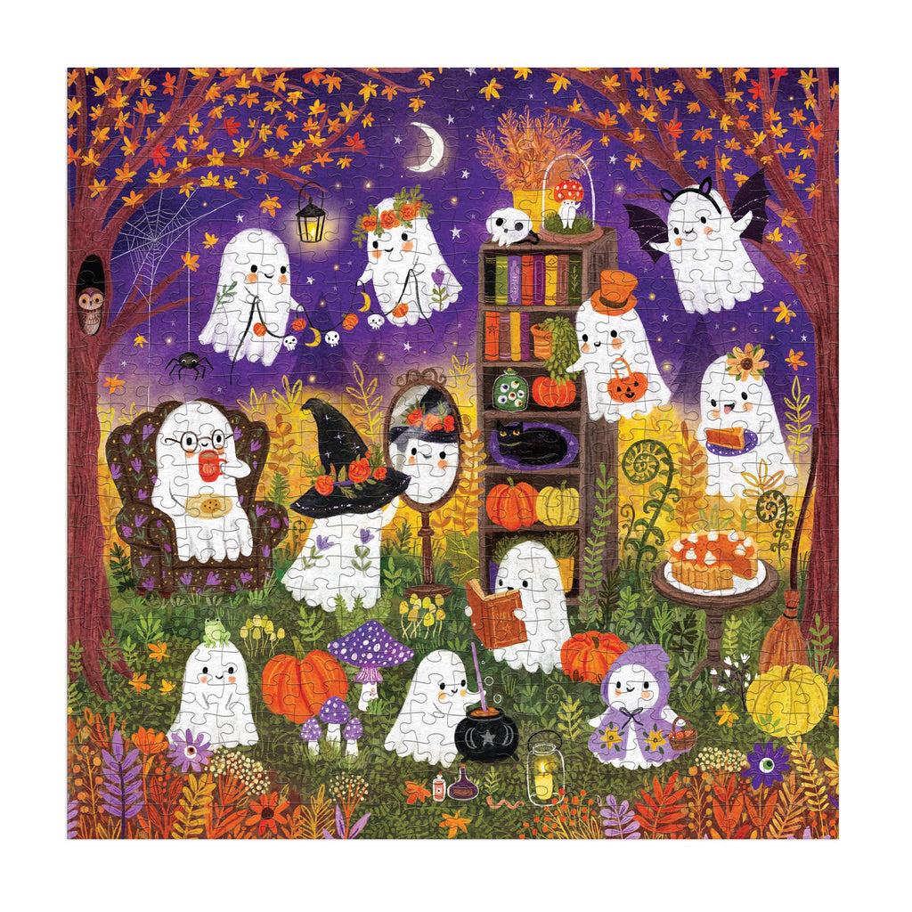 The Ghostly Gathering 500 Piece Family Puzzle by Jenny Miriam Hughes features cartoon ghosts celebrating Halloween in an autumn forest, surrounded by pumpkins, treats, and books under a starry sky—perfect for family puzzle nights.