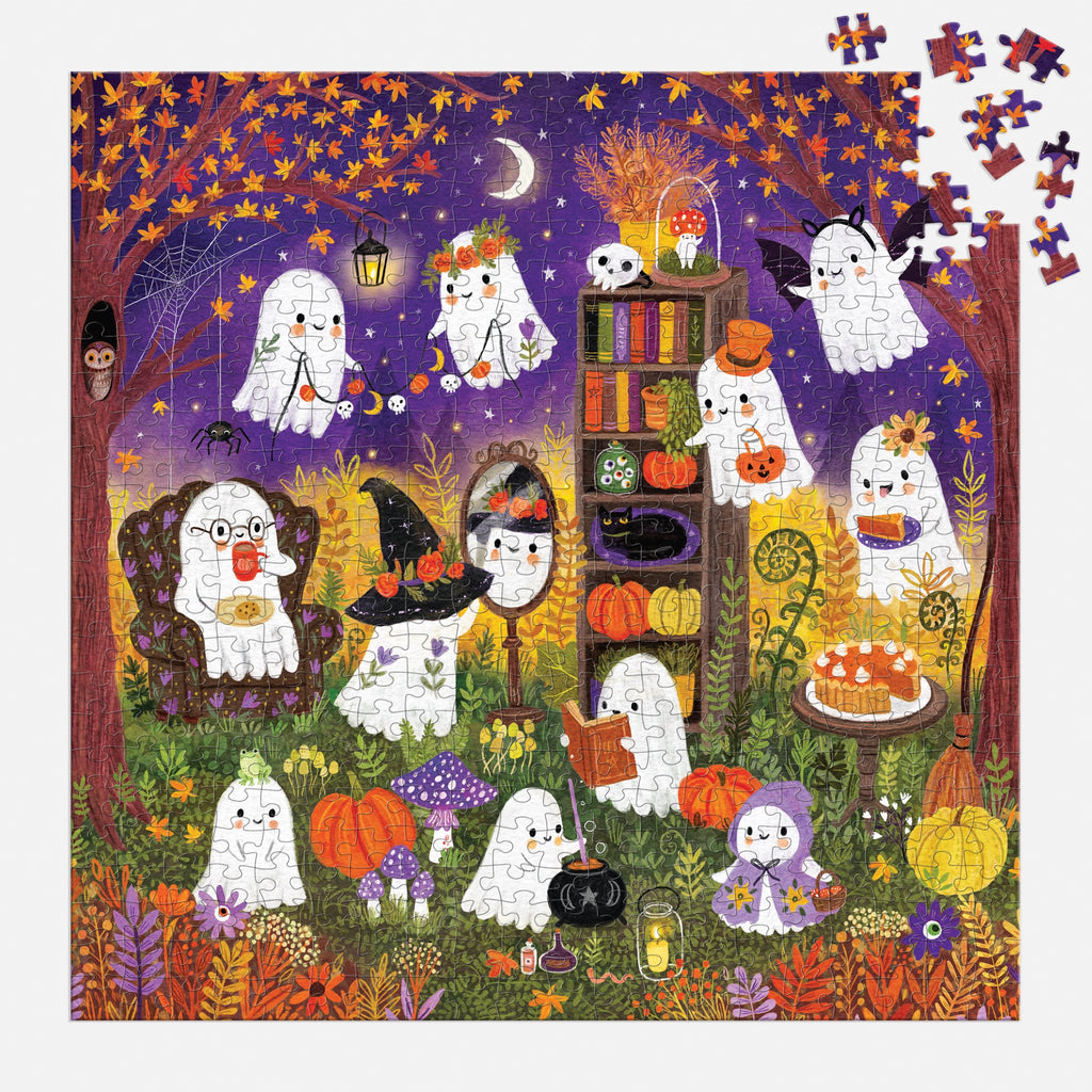 The Ghostly Gathering 500 Piece Family Puzzle by Jenny Miriam Hughes features cute ghosts at a Halloween tea party in a moonlit garden filled with pumpkins, autumn leaves, and treats. Some pieces are missing from the top right corner.