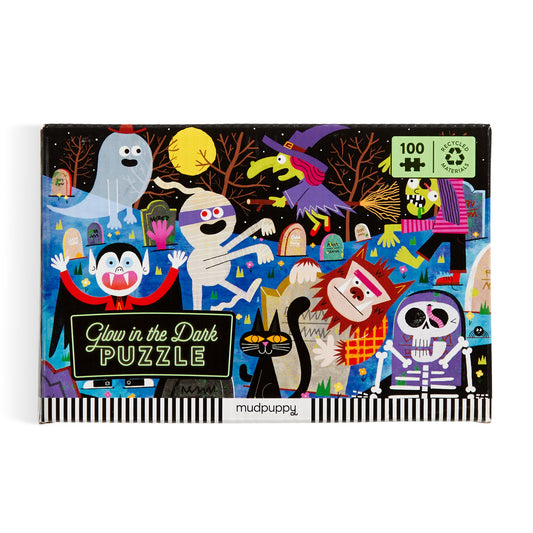 The Rob Hodgson Haunted Graveyard 100 Piece Glow in the Dark Puzzle features spooky ghosts, monsters, and graveyard scenes for vibrant family fun on Halloween. Watch vampires, witches, mummies, and more glow at night!.