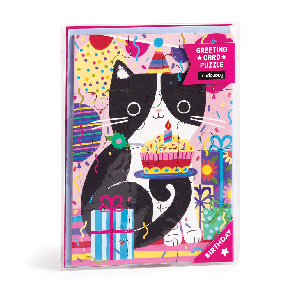 The Tara Lilly Purr-fect Cat Birthday Greeting Card Puzzle features a black and white cat in a party hat with cake, presents, and confetti—ideal for feline-loving friends. The card displays “Greeting Card Puzzle” and “Birthday.”.