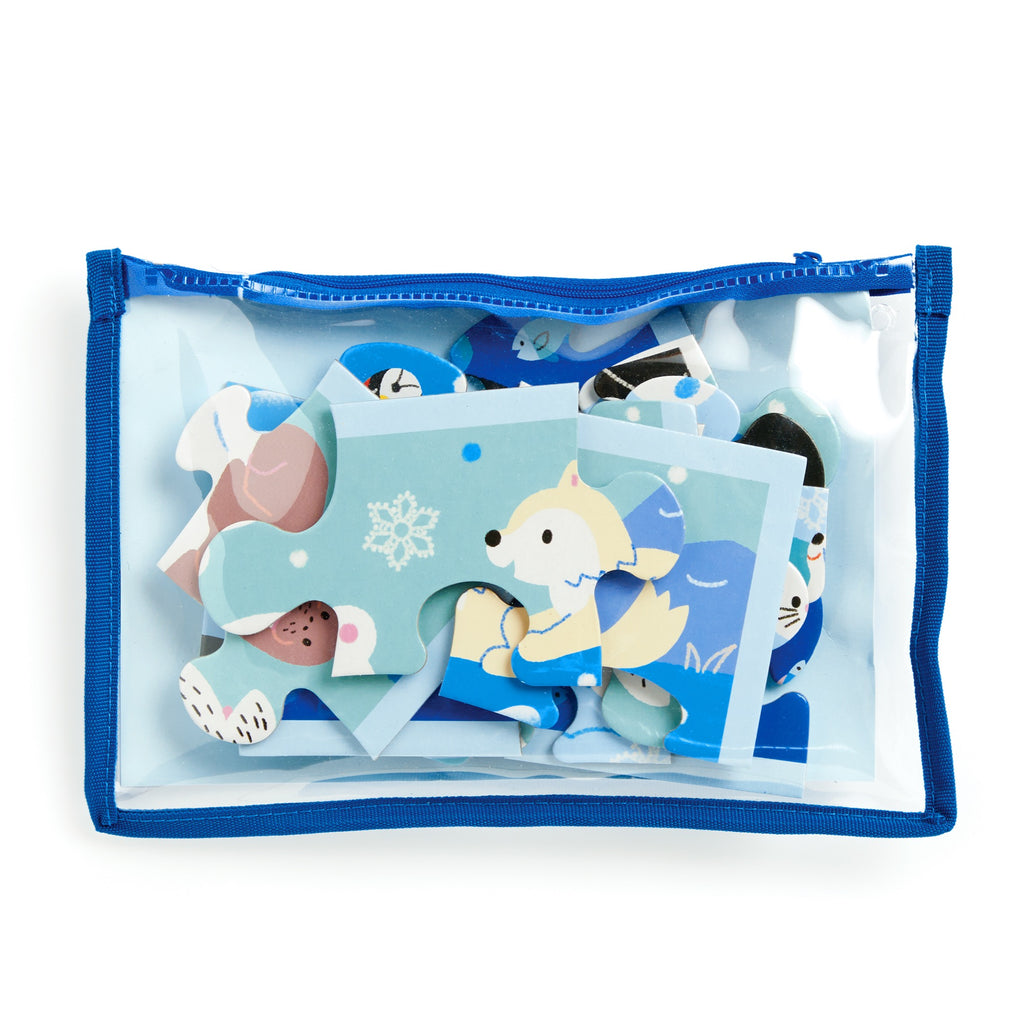 The Milisande Luthringer Arctic Friends 12-Piece Pouch Puzzle features large illustrated blue-and-white animal pieces, like a fox, in a clear zippered pouch with blue trim—perfect for polar pals fans.