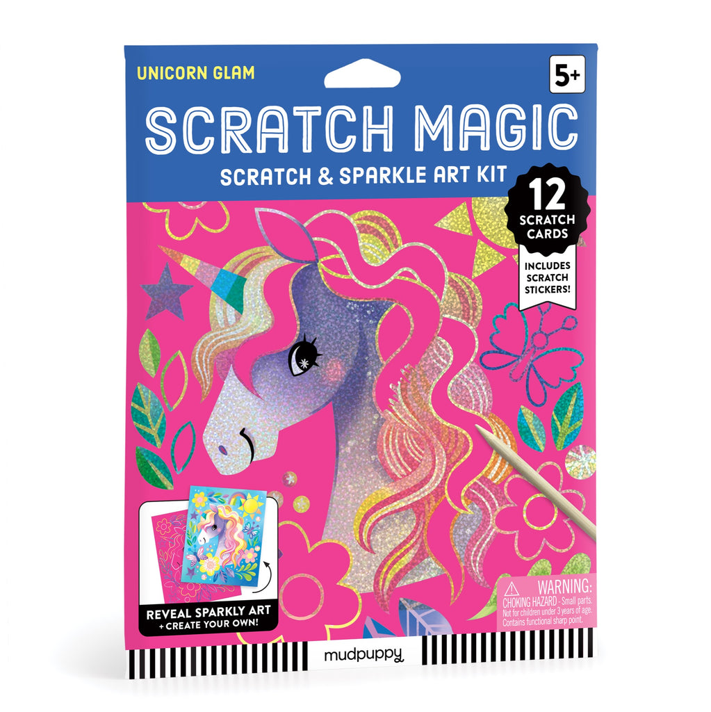 A colorful box labeled Unicorn Glam Scratch Magic by Katie Wood for ages 5+, featuring a glittery unicorn on pink with flowers. Includes 12 scratch cards, unicorn stickers, and a wooden stylus.