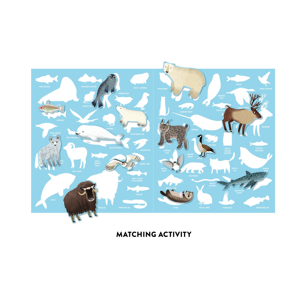 The Arctic Life Sticker Play Reusable Activity Set by Hannah Abbo features movable pieces of Arctic animals and fish, such as polar bear, musk ox, and narwhal, to match to silhouettes and names on a blue background.