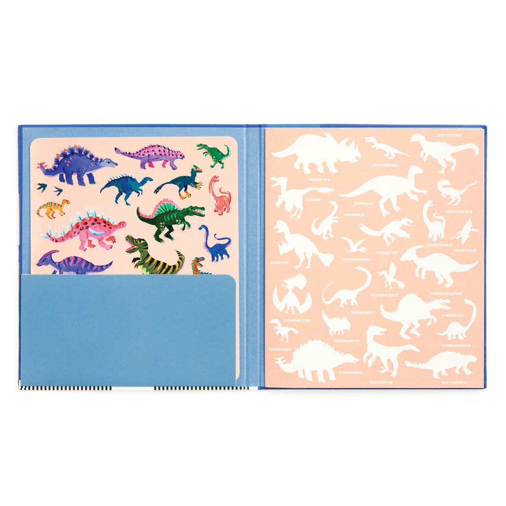 An open Dinosaur Park Sticker Play Reusable Activity Set by Christiane Engel shows colorful Jurassic dinosaur stickers on the left, white labeled silhouettes on a peach background to the right, and a blue pocket holding the sticker sheet.