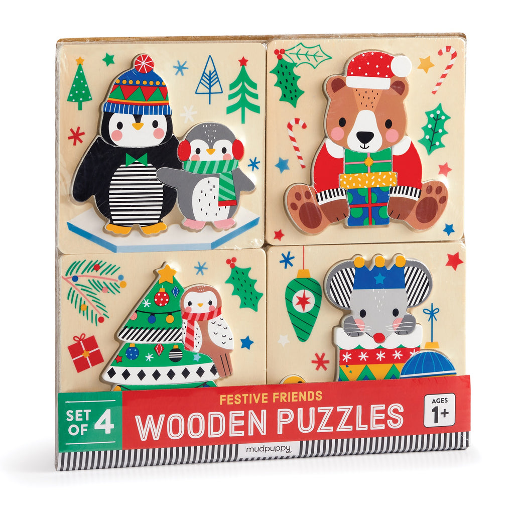 The Wendy Kendall Festive Friends Set of 4 Wood Puzzles features holiday-themed animal designs—penguin, baby penguin, bear, owl, and mouse—among gifts and trees; perfect for ages 1+.