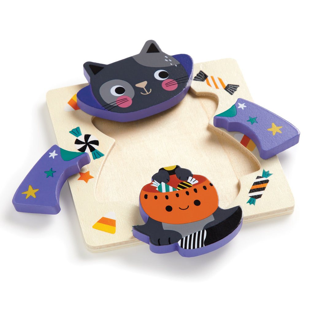 The Wendy Kendall Spooky Friends Set of 4 Wood Puzzles features spooky characters—a smiling black cat, a cheerful pumpkin, and a candy-covered purple piece—on a durable light wood board.