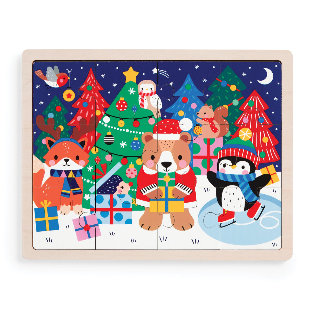 The Wendy Kendall Festive Friends 12 Piece Wooden Tray Puzzle showcases holiday animals—fox, bear, and penguin in winter attire with gifts—amid decorated trees, an owl, squirrel, bird, and a snowy night sky.